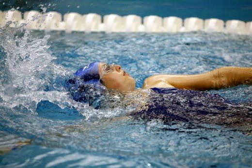 Teenage Female Athlete swimming